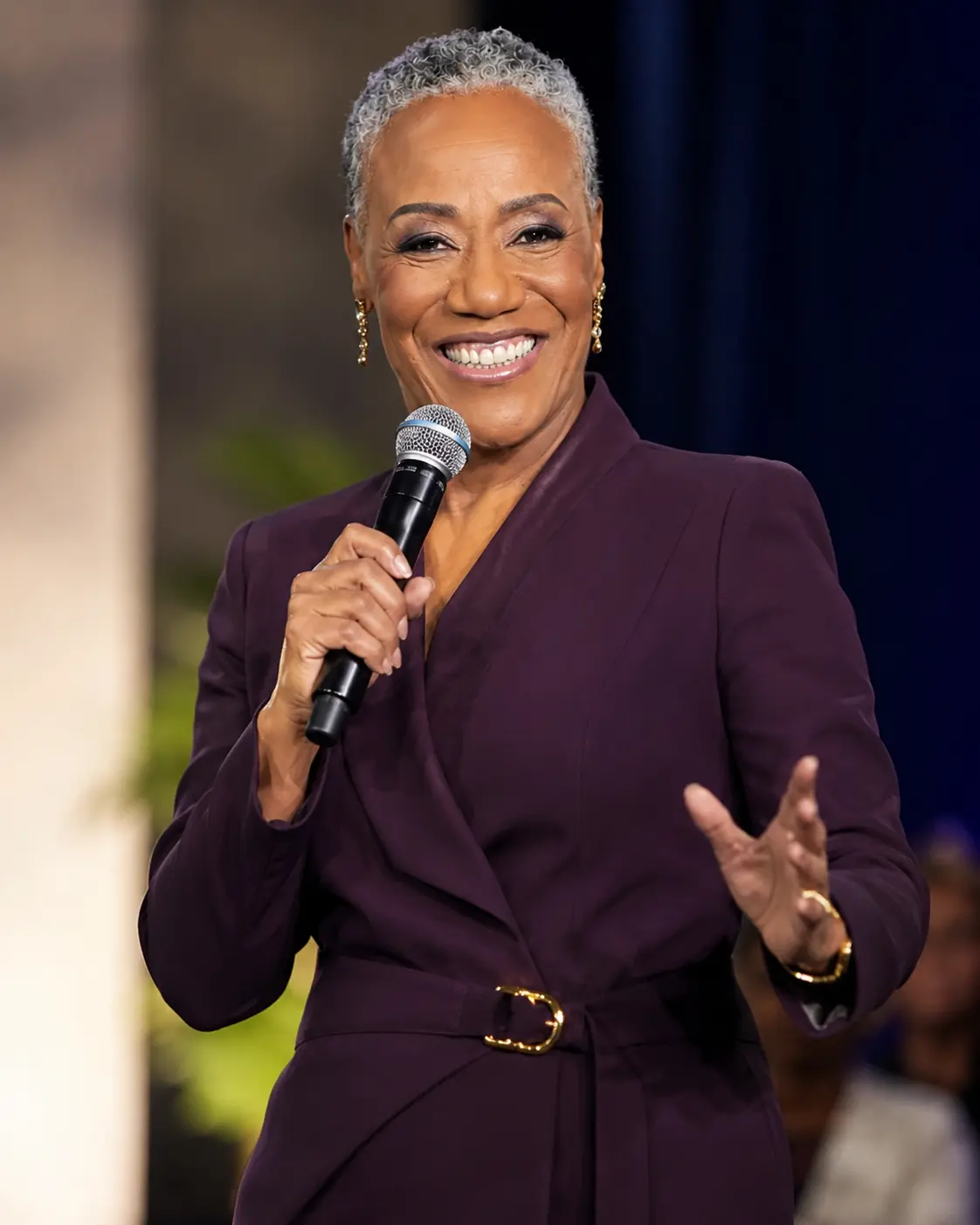 Carolyn speaking on stage